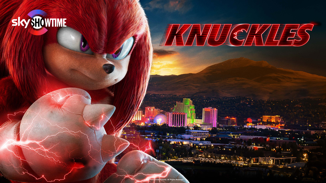 Karakteren Knuckles fra Sonic-filmene står foran en by med lyn rundt hanskene sine.